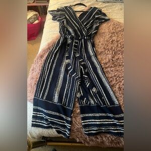 Navy and white striped jumpsuit; size medium